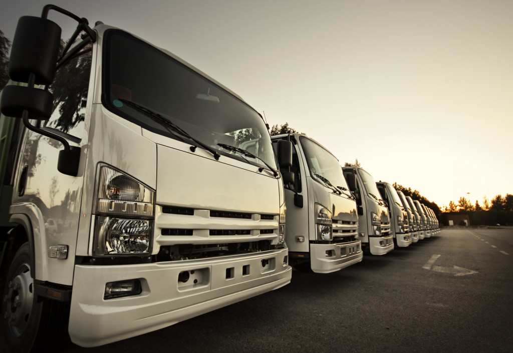 row of commercial fleet trucks in sepia tone