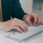 man typing on a keyboard