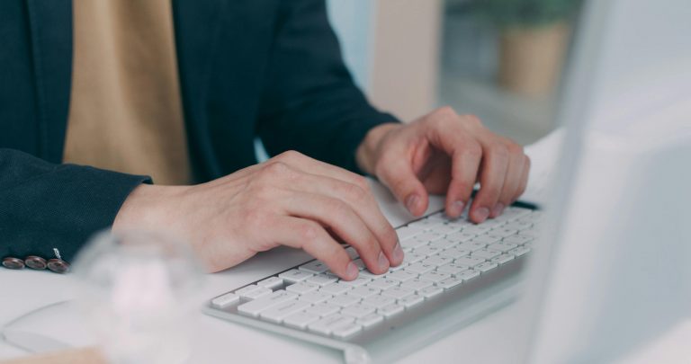 man typing on a keyboard